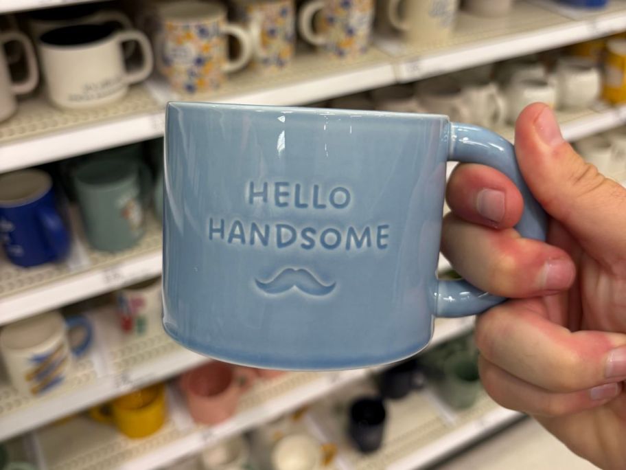 Hello Handsome Mug in hand in store