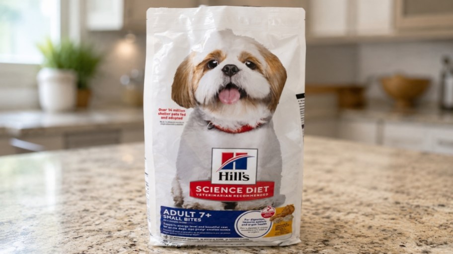 a bag of adult small dog food on a kitchen counter
