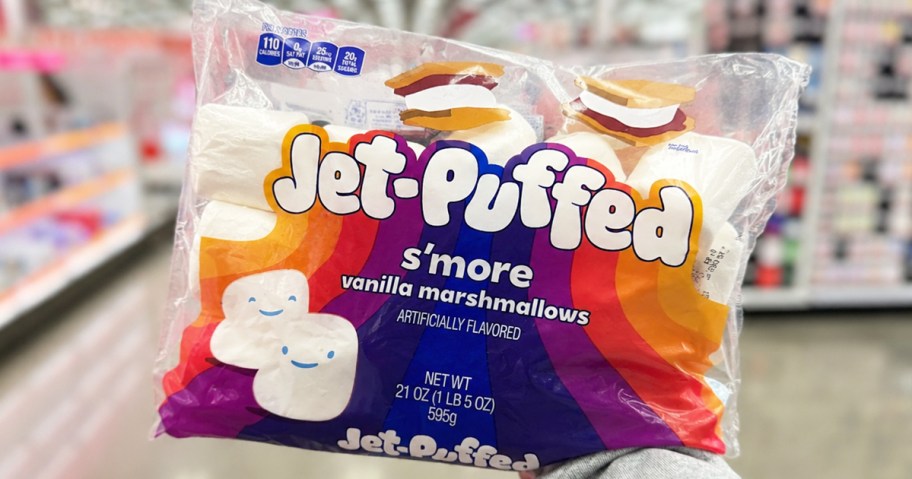 hand holding up a bag of Jet-Puffed S'more Vanilla Marshmallows in store