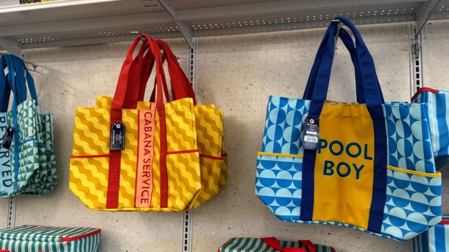 tote bags hanging a display wall in a store