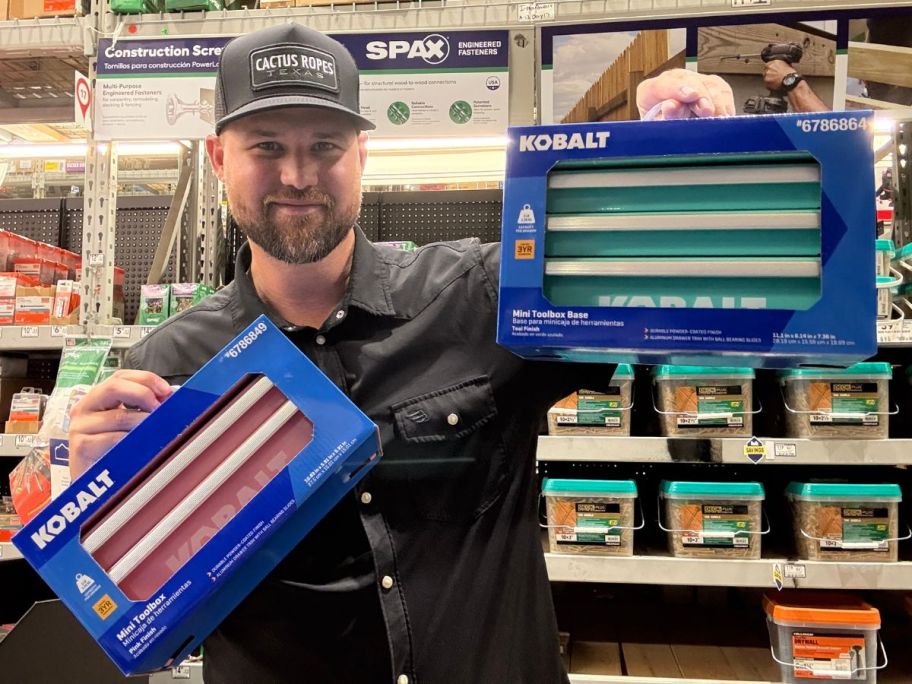Man holding 2 sizes of Kobalt mini tool boxes