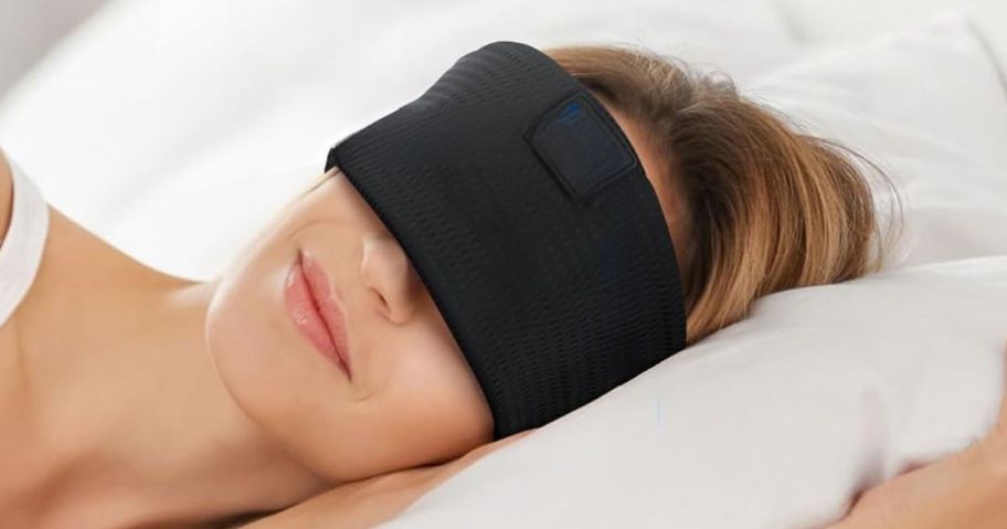 woman laying down while wearing LOVE EYE Sleep Mask Headphones