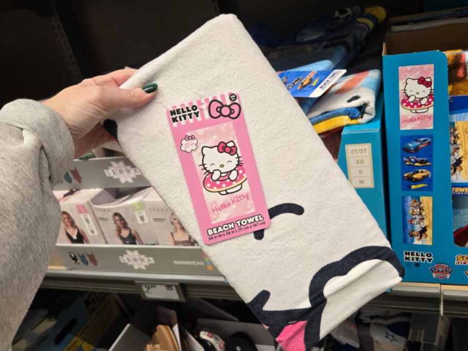 hello kitty beach towel in hand in store