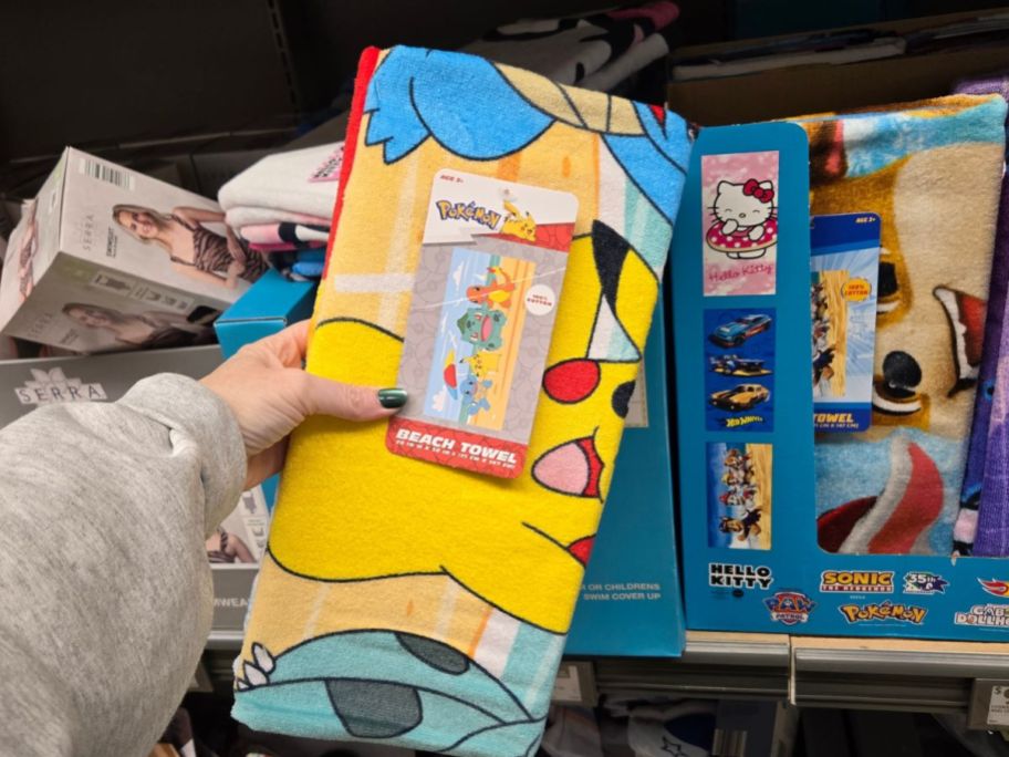 pokemon beach towel in hand in store