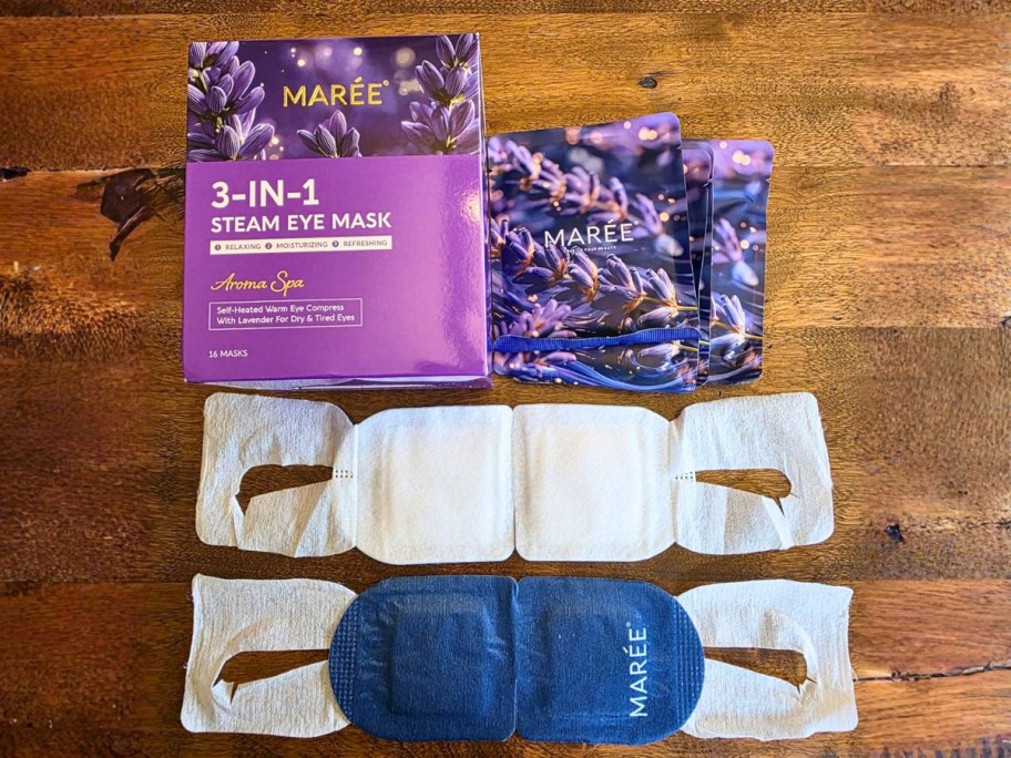 a box of steam heated eye masks with the packs and 2 masks open