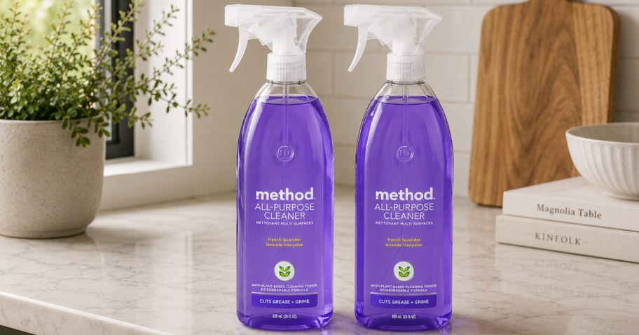 Two purple colored bottles of method, all-purpose cleaner sprays on kitchen countertop