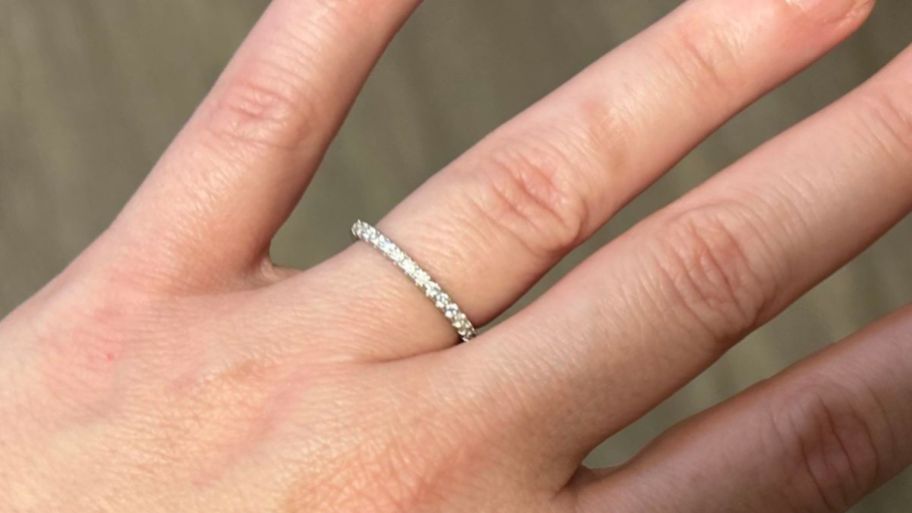 hand wearing Moissanite band