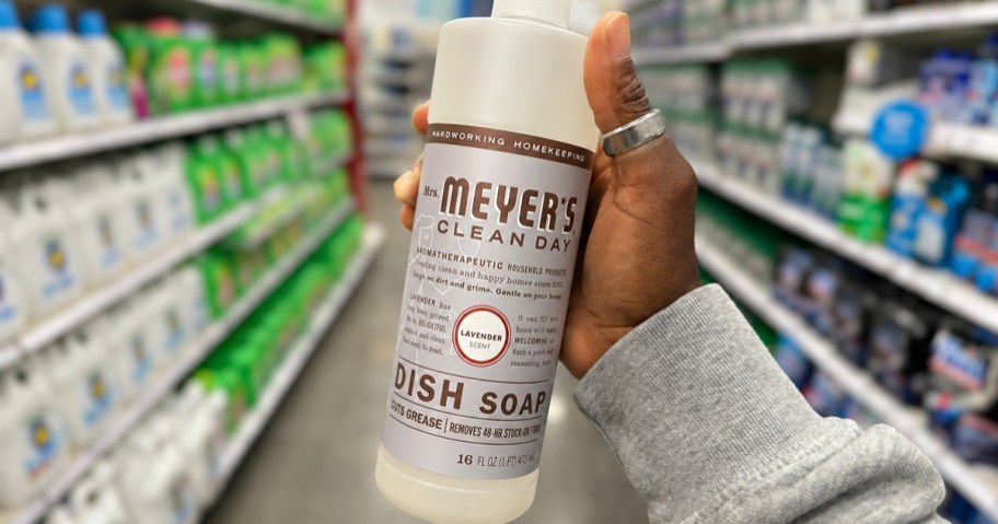 hand holding up a bottle of Mrs. Meyer's Dish Soap in store aisle