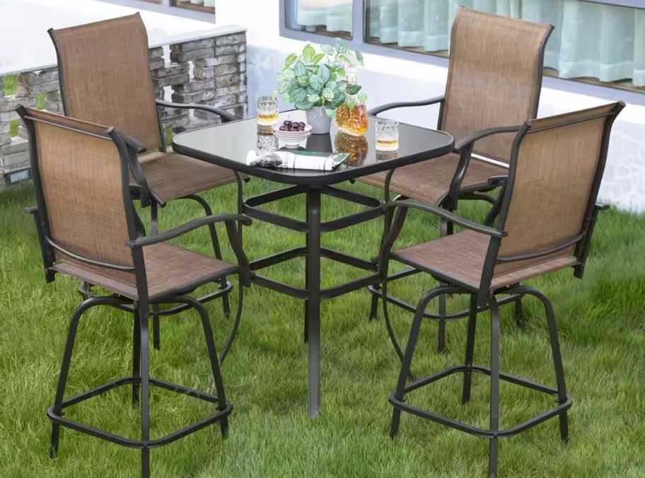 high top patio dining set in grass