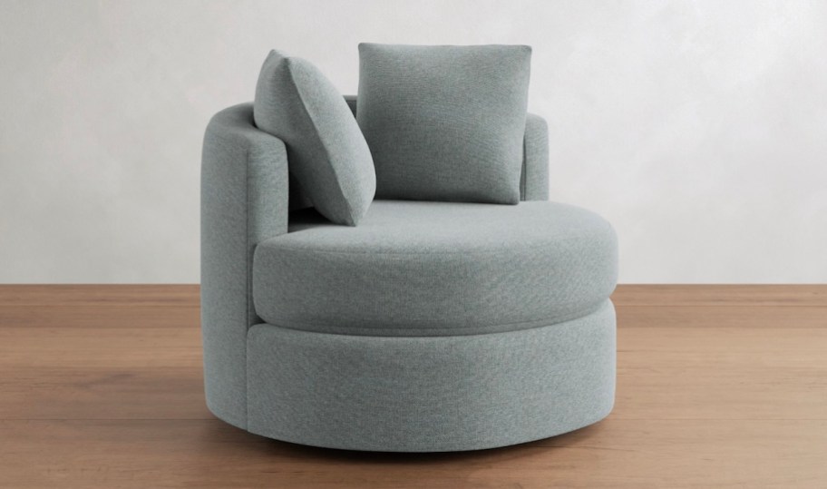 blue swivel chair on wood floor