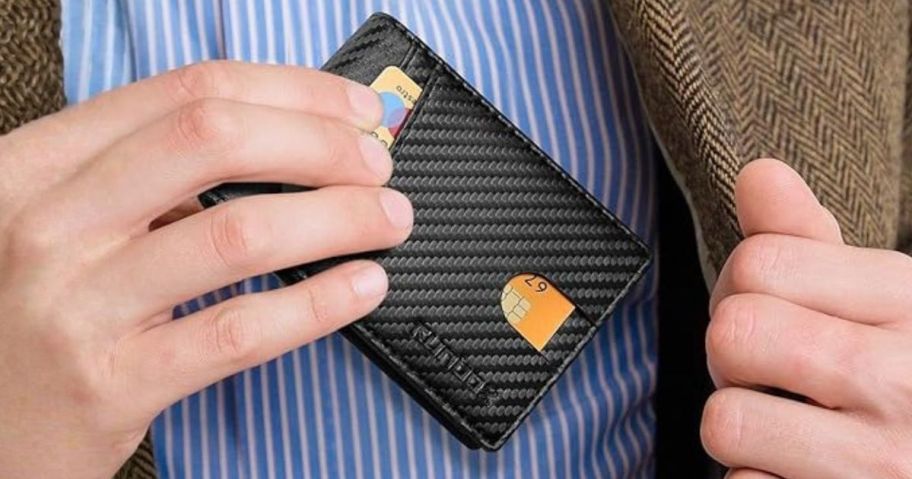 man putting RUNBOX Men's RFID Wallet in jacket