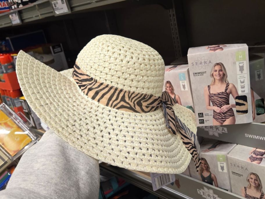 Serra Animal Print Ribbon Beach Hat in hand in store