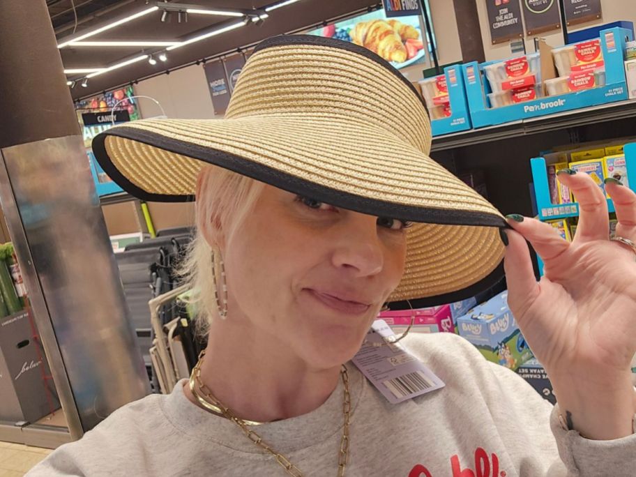 stefanie wearing Serra Black Ribbon Beach Hat in store