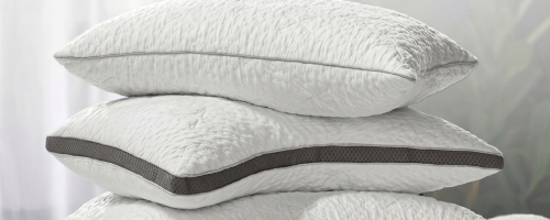 stack of Sleep Number pillows on a bed
