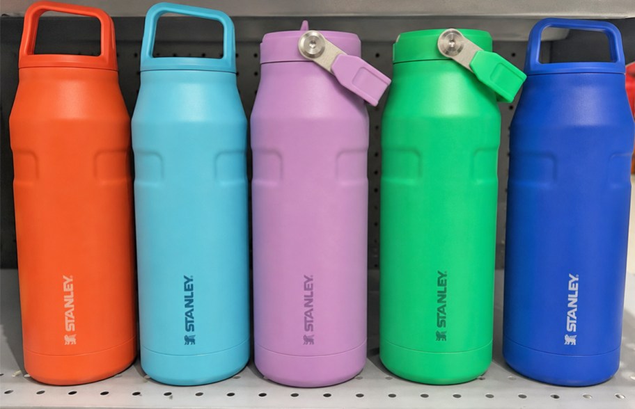 Colorful Stanley bottles on display shelf