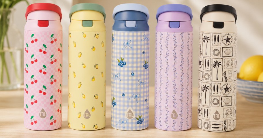 5 printed water bottles on a counter
