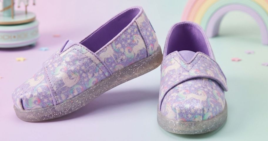 Stock images of TOMS kids alpargartas shoes with unicorns on them