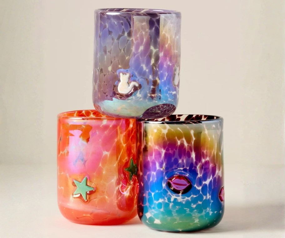 three icon juice glasses with iridescent finishes