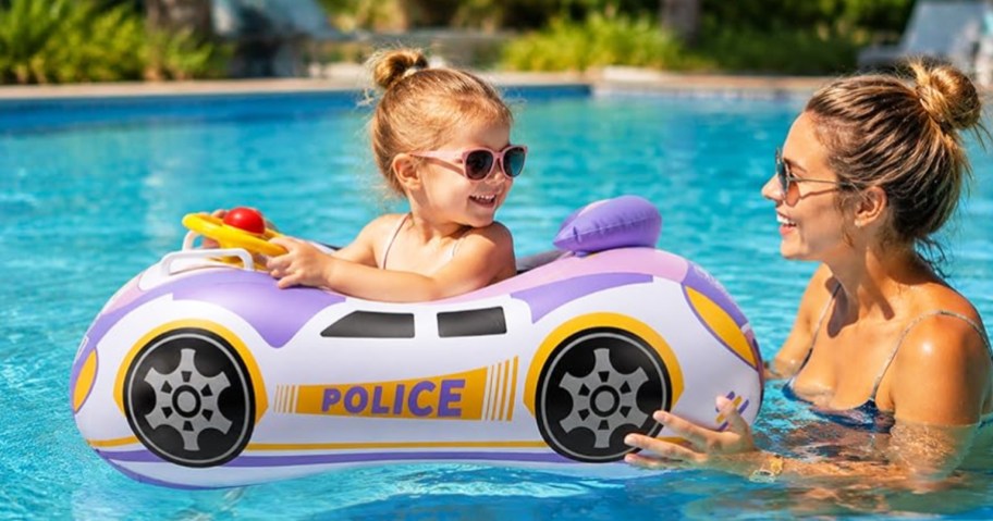 mom pushing toddler in a police car pool float