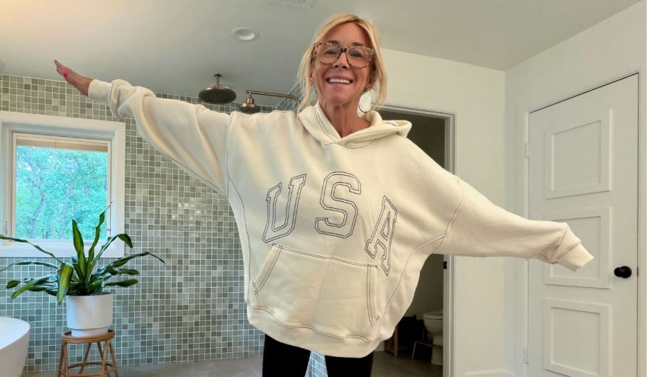 Collin wearing oversized sweater that says USA
