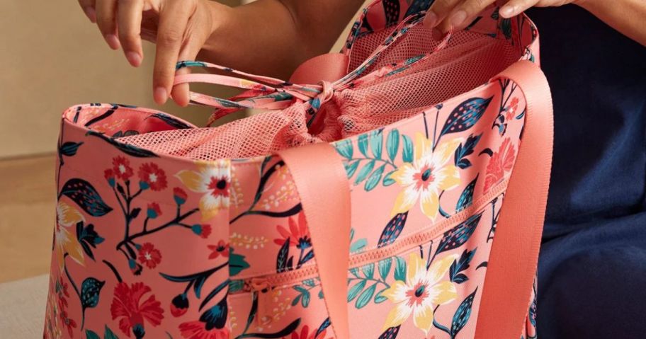 Woman tying a Vera Bradley Tote Bag