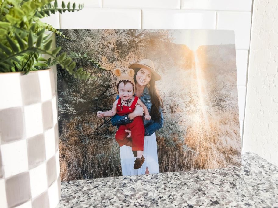 A metal photo print from Walgreens with a mom holding a little boy