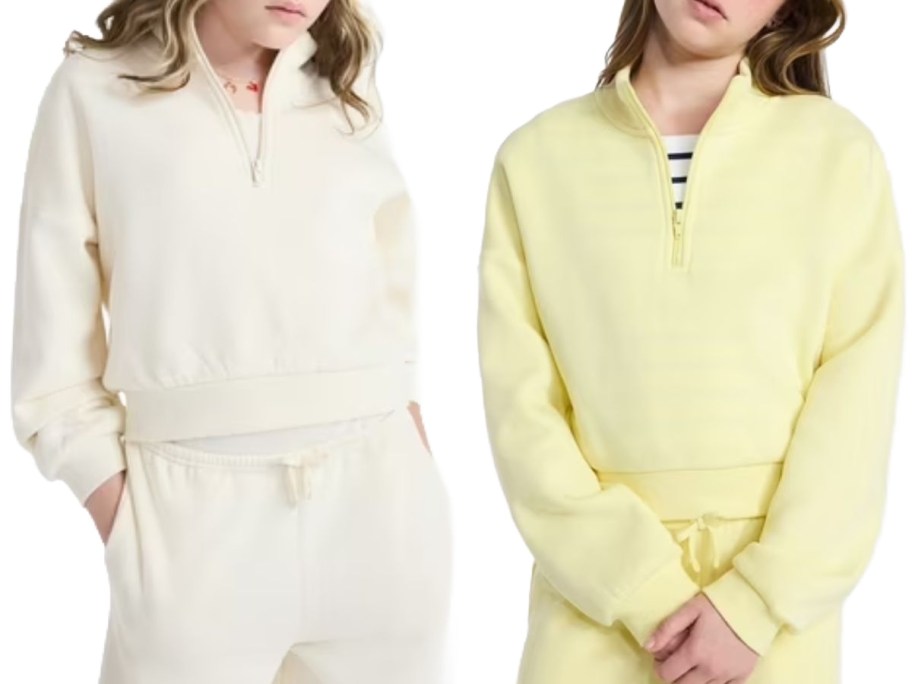 Stock images of two girls wearing weekend Academy Sweatshirts