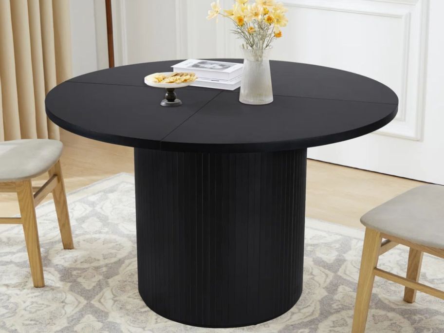 A Cuji 47" Round Pedestal Dining Table