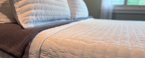 White bedding set with matching white shams