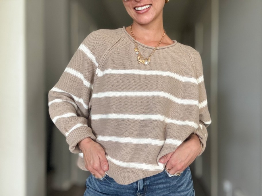 a woman in a striped sweater