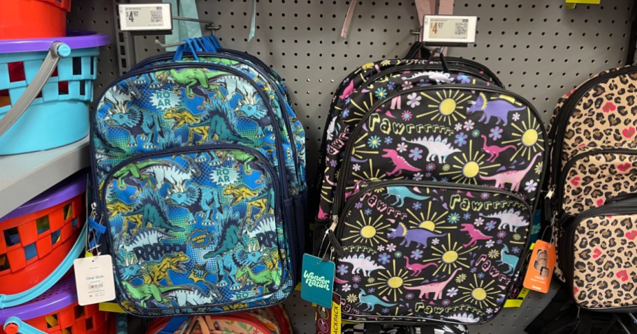 Wonder Nation Kids Backpacks with dino prints hanging in store