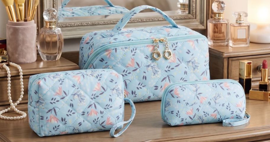 YTL 3-Piece Travel Cosmetic Bag set on dresser
