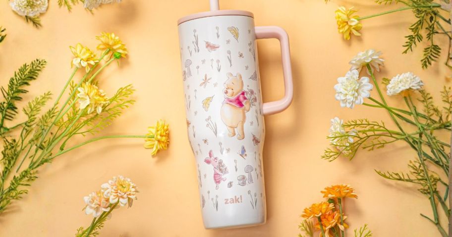winner the pooh Zak Designs 30oz Double-Wall Stainless Steel Vacuum-Insulated&nbsp;Sutton Straw Tumbler laying amongst flowers
