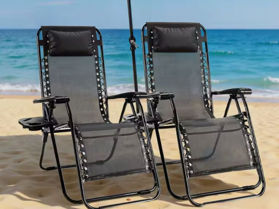 Two zero gravity lounge chairs on a beach