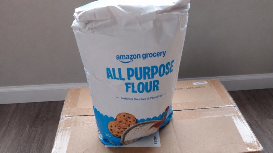 a 2 pound bag of all purpose flour sitting on a cardboard box