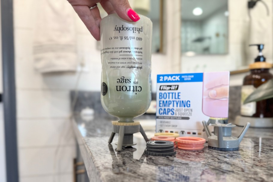upside down bottle with caps next to it