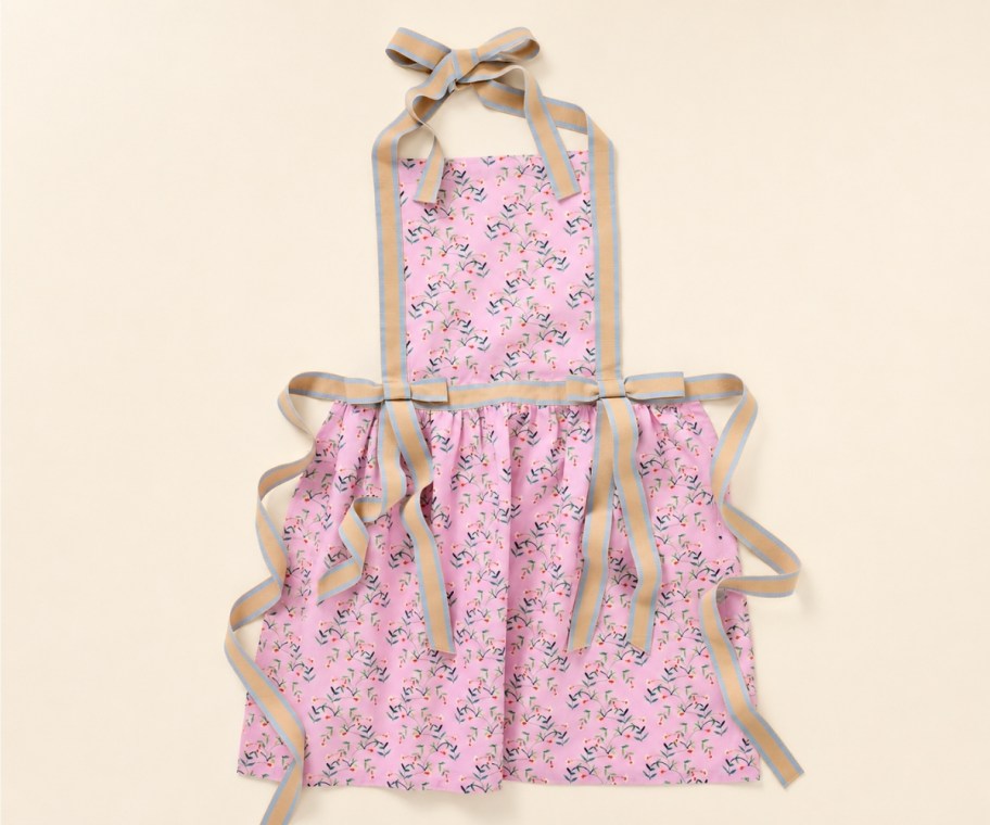 a pink floral print apron