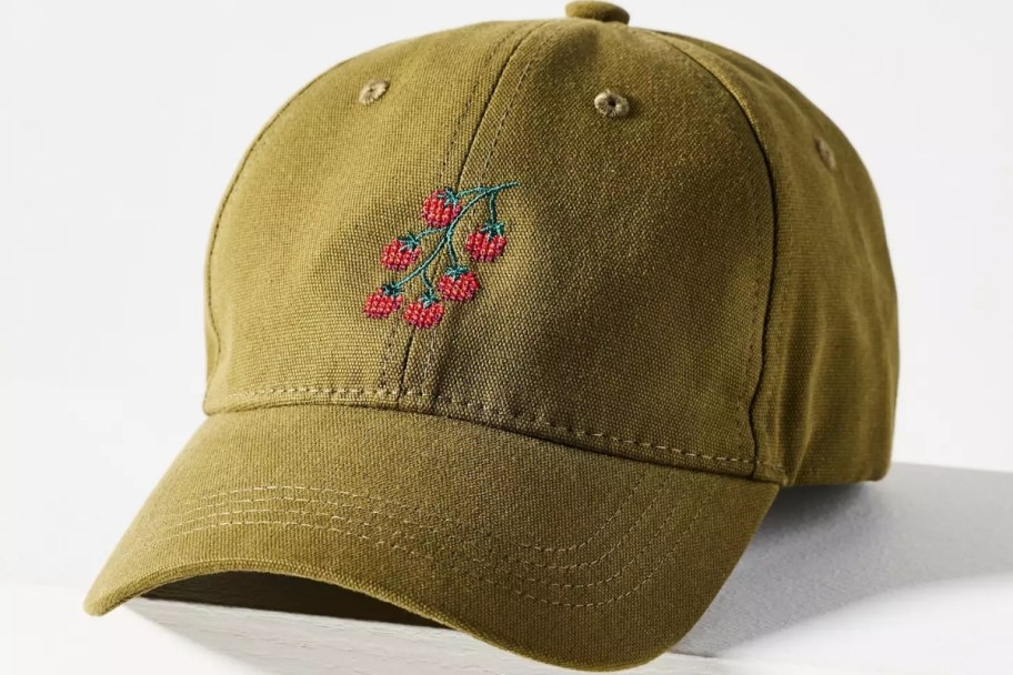 an olive colored baseball cap