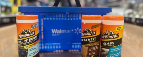 three armor all cans next to blue basket on floor