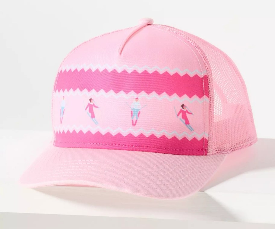 a pink trucker hat