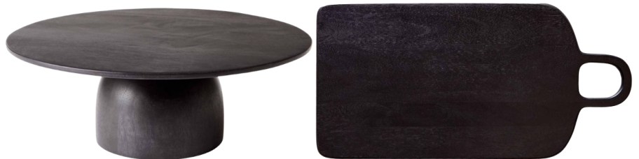 a black wooden cake stand and a black serving board