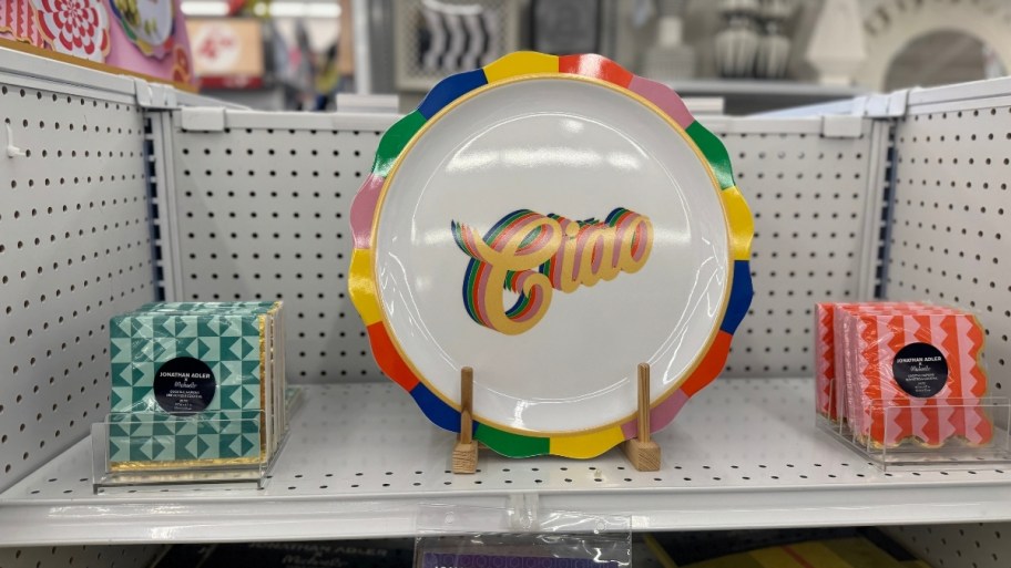 ciao serving platter and cocktail napkins on a store shelf