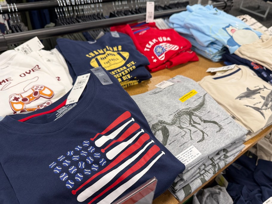 boys graphic tees on table