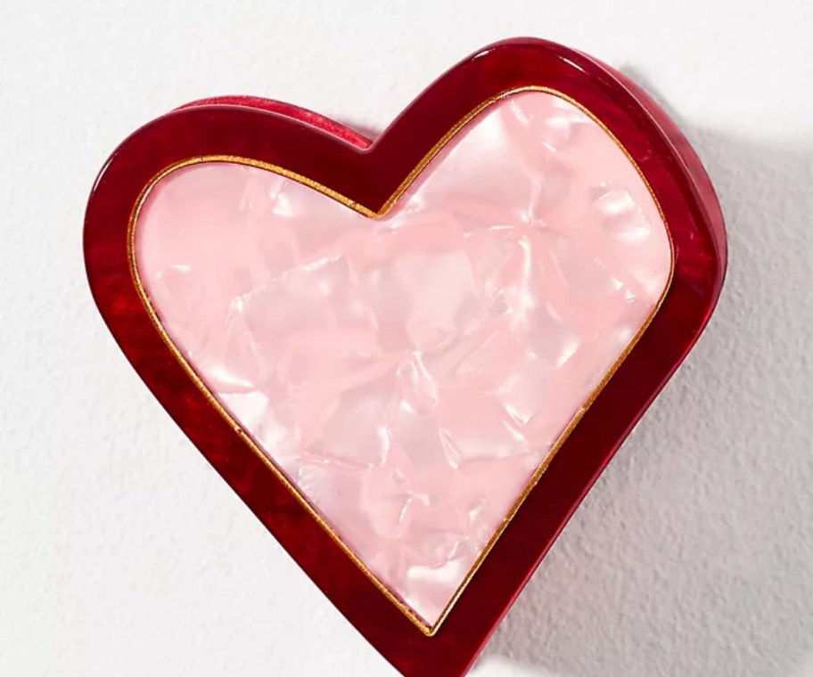 a pink and red heart shaped hair clip