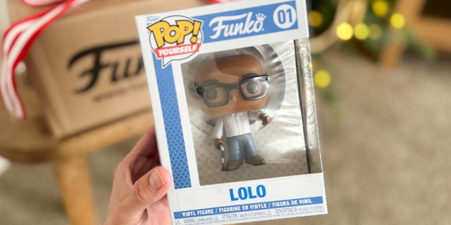 hand holding funko pop 