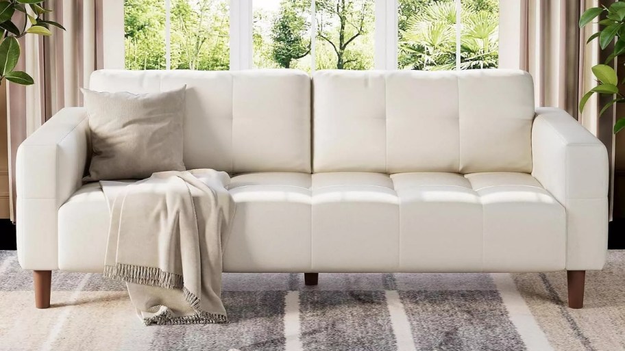 a white 3 seater sofa