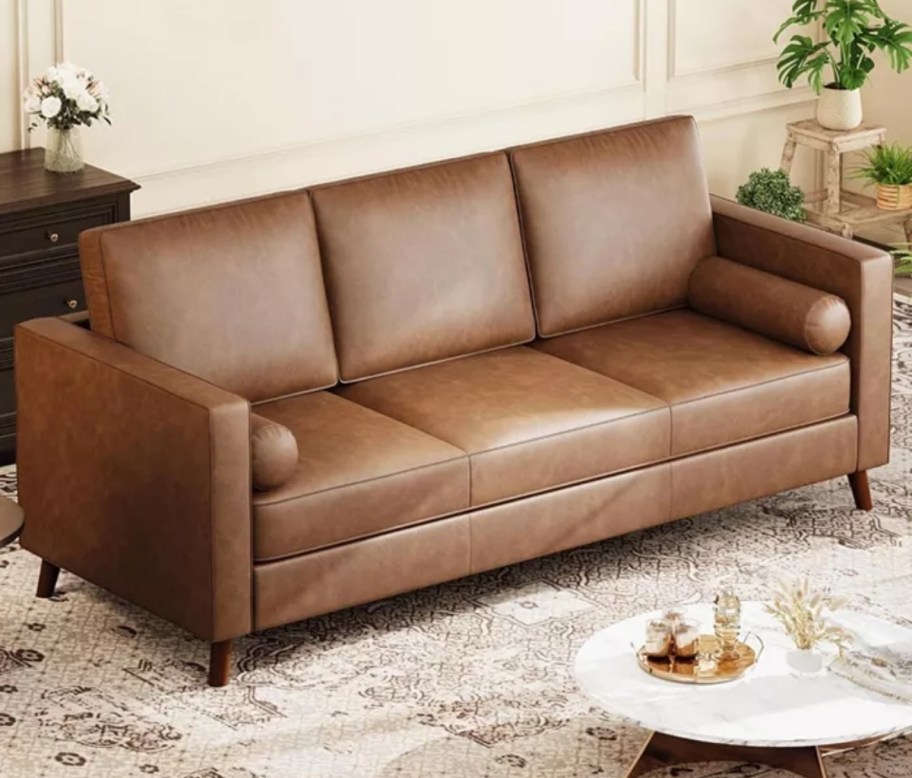a brown faux leather sofa. 