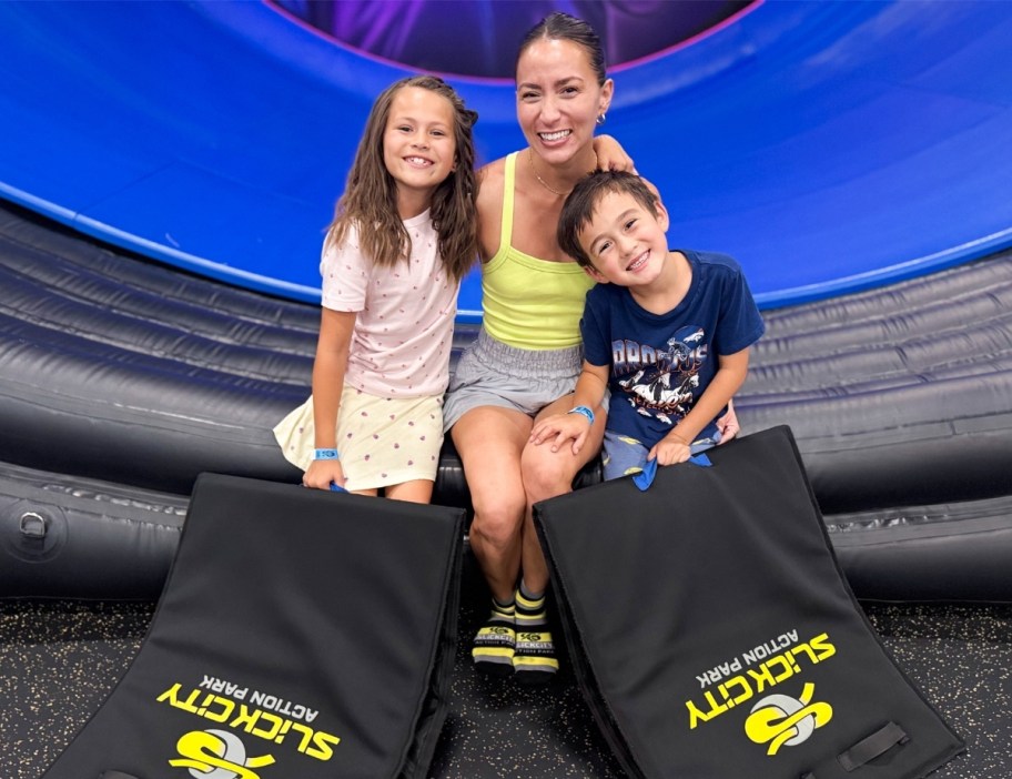 a mom with 2 kids and slide mats