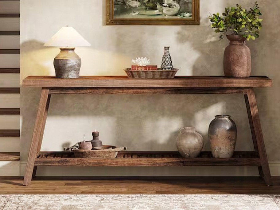 wood entryway table with decor 