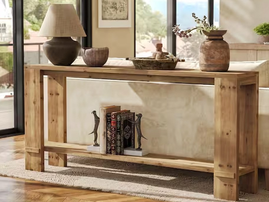 wood entryway table with decor 